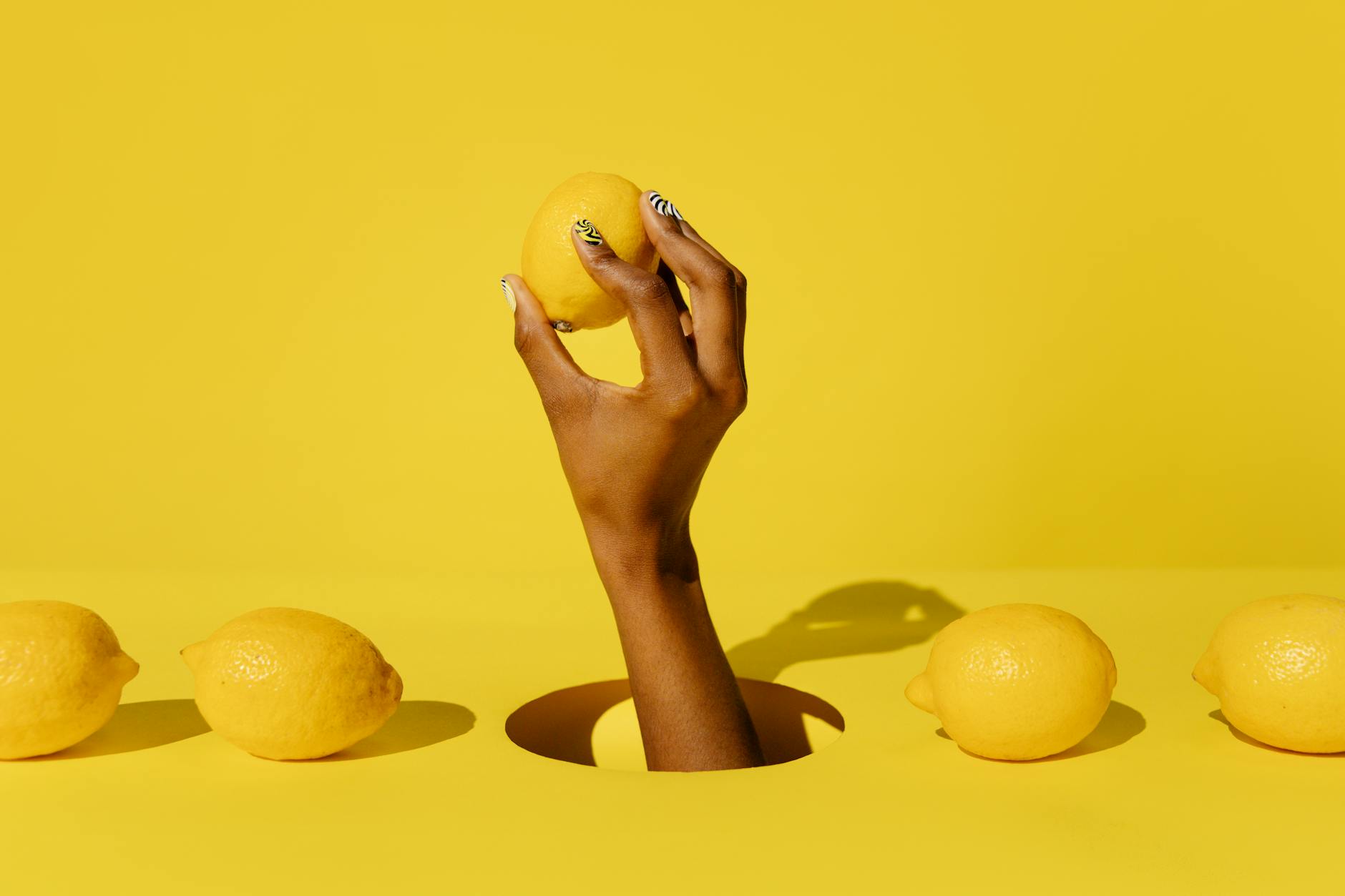Colorful arrangement of lemon vibrators and toys on a bright yellow background